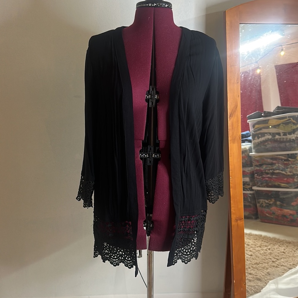 Lightweight sheer dressy cardigan. Lace trim adds elegance to any outfit.